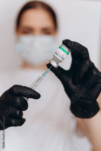 COVID-19, nCoV 2019 or Corona Virus 2019. Syringe injection and Vaccine in doctor hand, It use for prevention, immunization and treatment from corona virus infection.