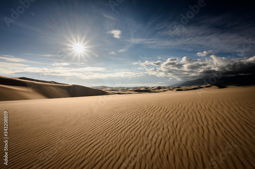 Fototapeta Naklejka Na Ścianę i Meble -  Sun Burst Over Rippled Dune