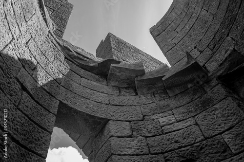 Fotografija A ruin or folly - graphic view of the spiral staircase in a castle circular towe
