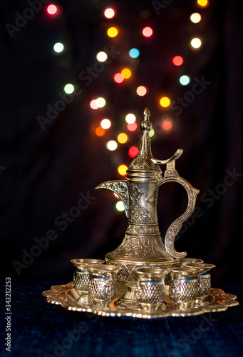 Turkish silver tea set with festive  bokeh photo