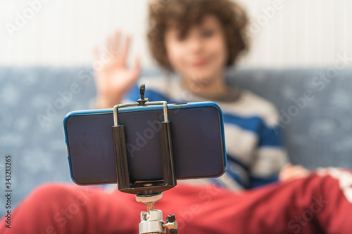 Konstfotografi Children saluting parents or friends during an online video calling