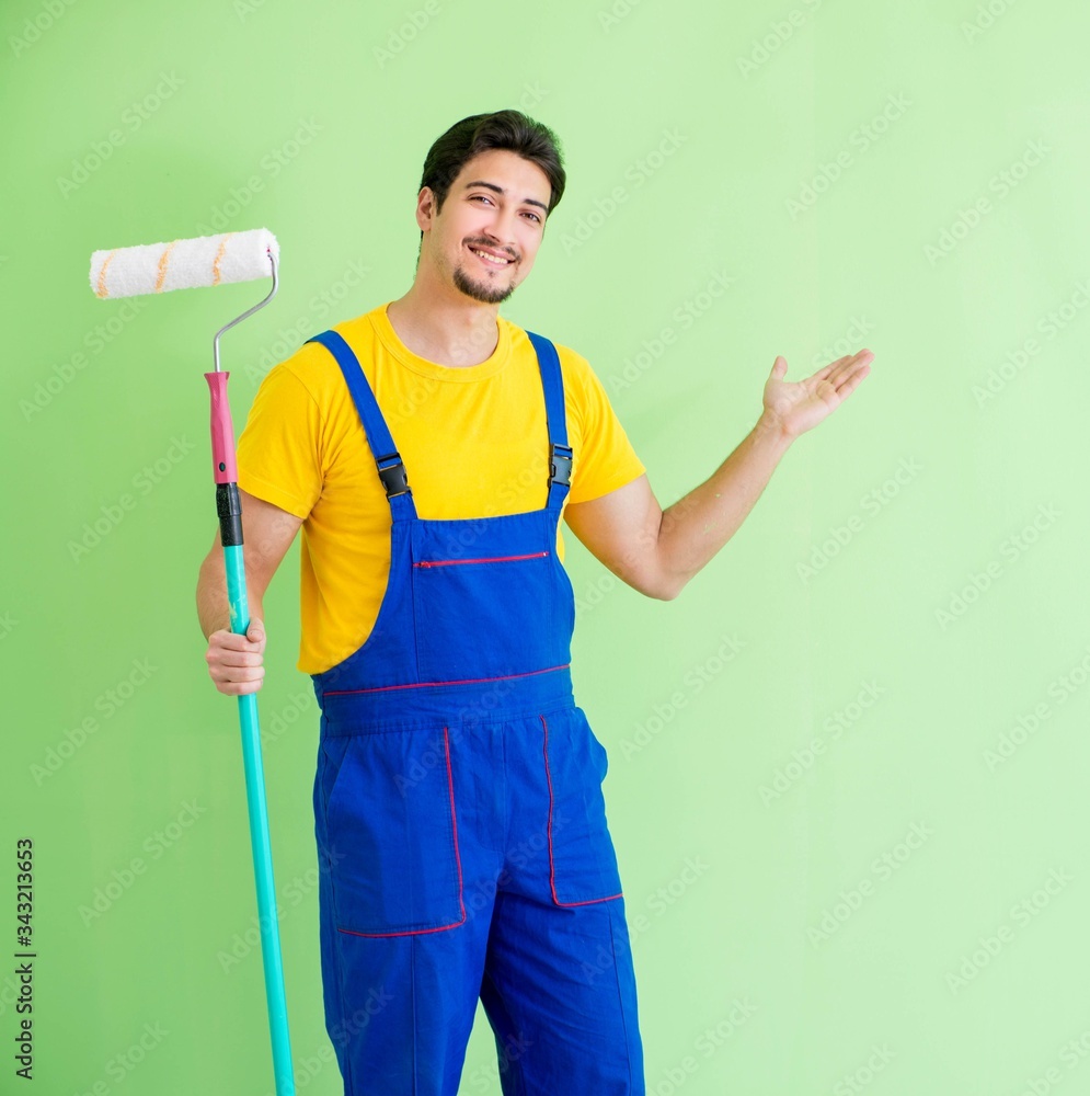 Young painter doing renovation at home Young painter doing renovation at home