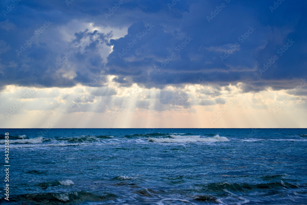 Tropical beach with colorful sunset, cloudy sky. A copy of the space. Tropical beach with colorful sunset, cloudy sky. A copy of the space.