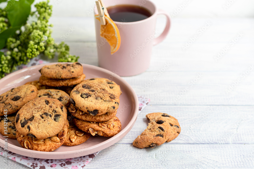 Chocolate Chip Cookies. Homemade baking. Round shape, medium size. On a white wooden background. Chocolate Chip Cookies. Homemade baking. Round shape, medium size. On a white wooden background.