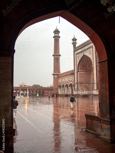 Jama Masjid of Delhi, is one of the largest mosques in India at rainy day photo