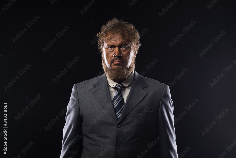 Fototapeta premium portrait of a dirty loser businessman on a black background