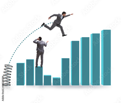 Businessman outperforming his competition jumping over