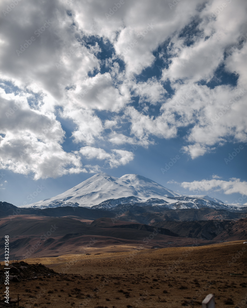 unt Elbrus in the clouds with an autumn landscape