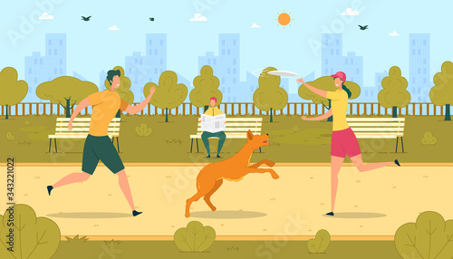 Teenager Throwing Frisbee to Girlfriend with Dog.