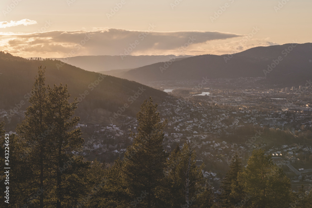 View of the evening city in the valley. View of the evening city in the valley.