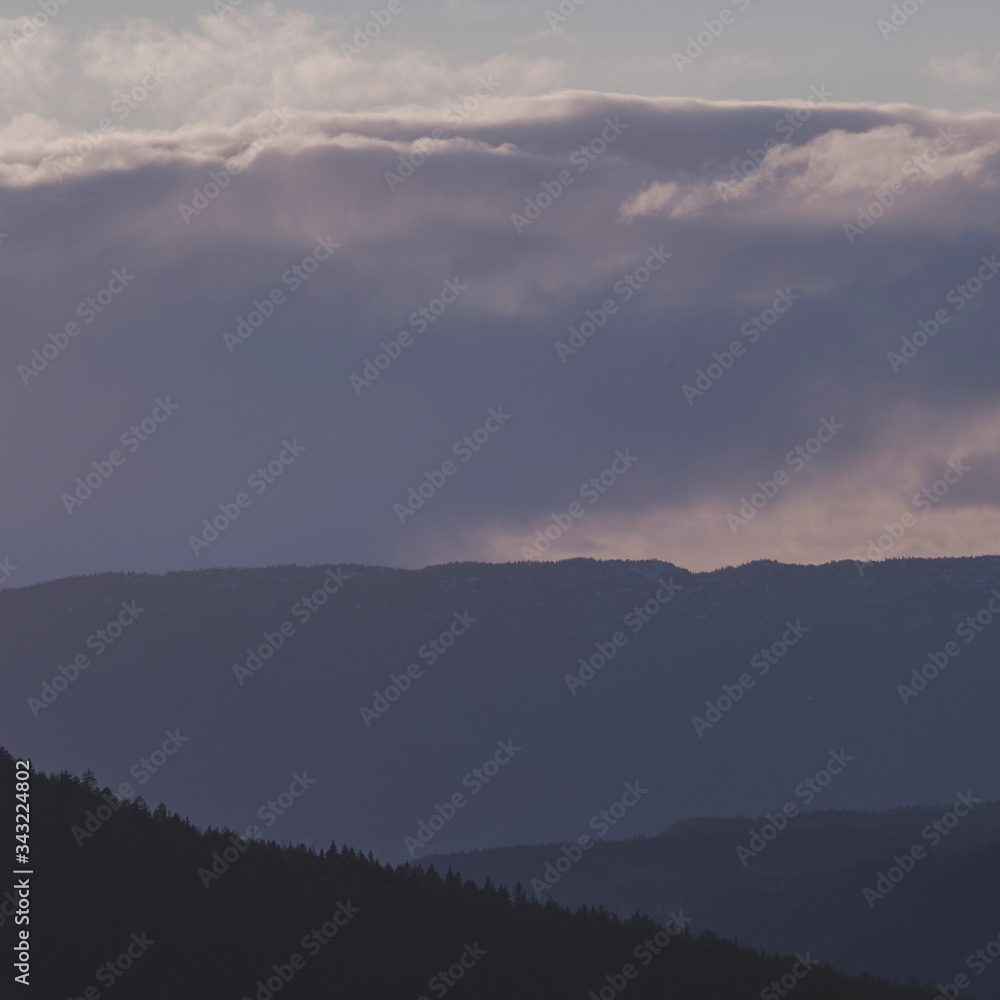 View of layers of mountains in evening.