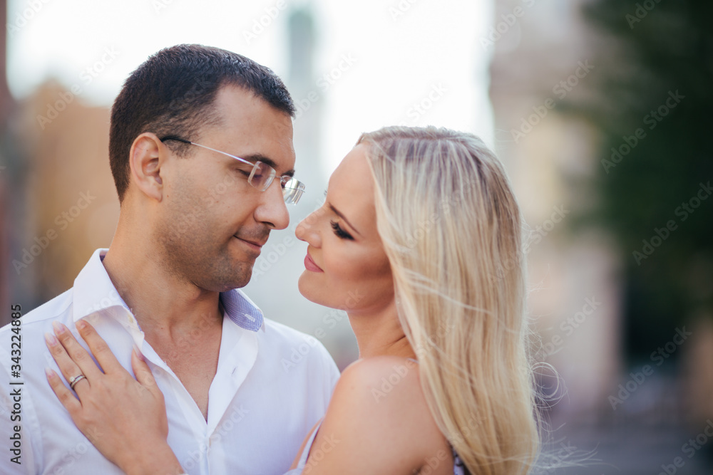 Naklejka premium Smiling couple in love outdoors, lviv. summer