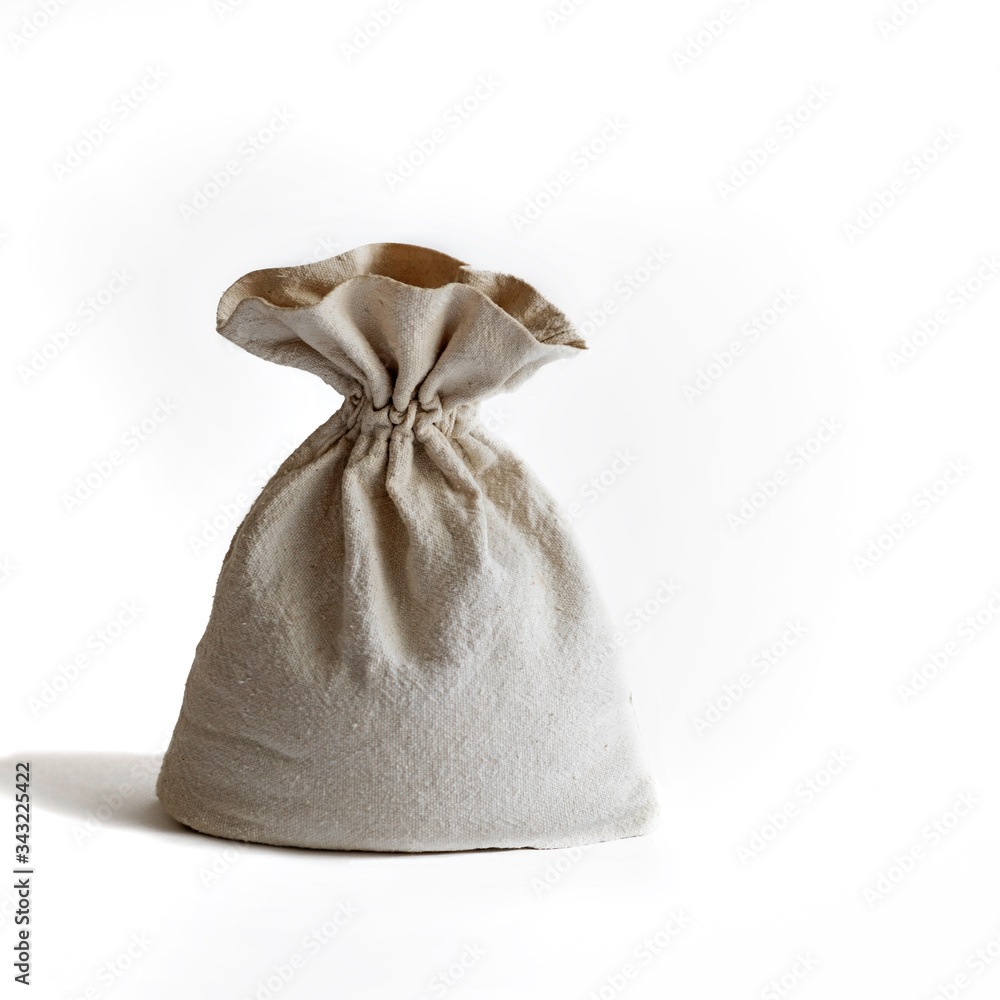 a bag of woven fabric, a linen bag on a white background, daylight, a bag for flour, grain, bulk products, money a bag of woven fabric, a linen bag on a white background, daylight, a bag for flour, grain, bulk products, money