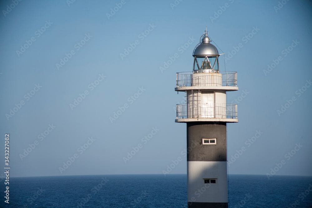Lighthouse an seagull in the port of the Spanish city of Aguilas