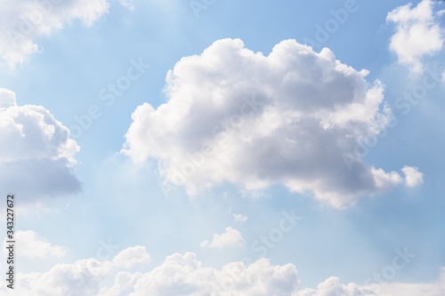 Light blue soft sky with delicate white clouds