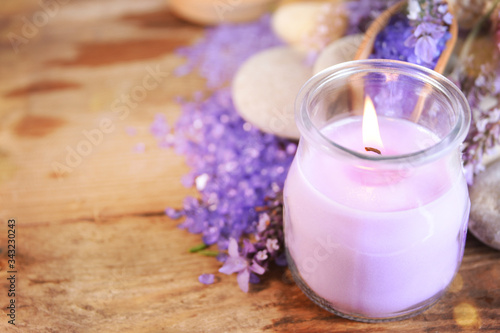 lavender oil in a glass bottle on a background of fresh flowers. Aromatherapy.