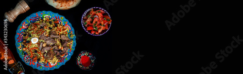 Samarkand pilaf with wegetables. on the black space background