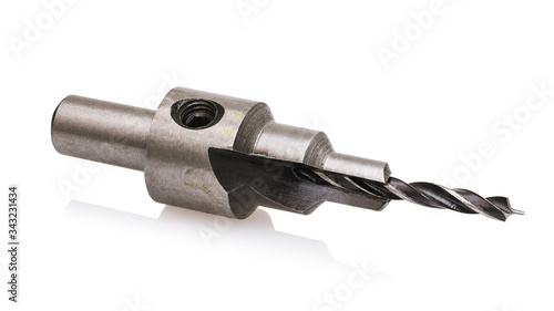 Drill by wood with countersink and drill depth limiter isolated on white background. Photo steking