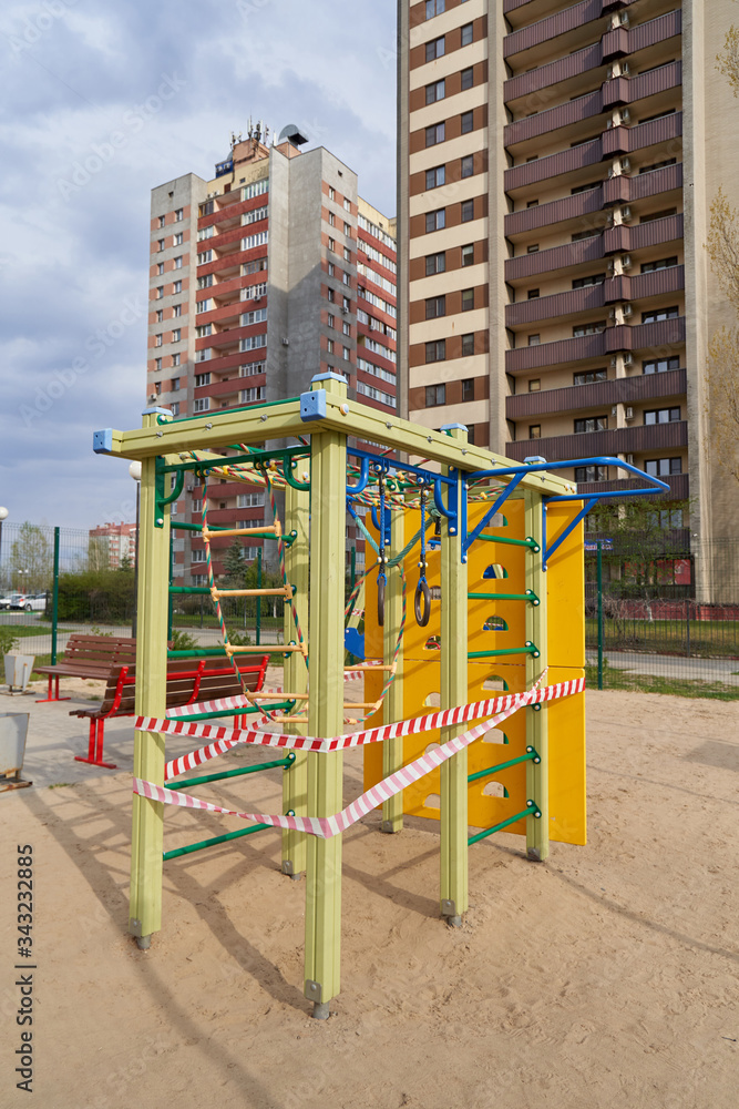 A closed playground for children with tape during the COVID-19 pandemic, Coronavirus. A closed playground for children with tape during the COVID-19 pandemic, Coronavirus.