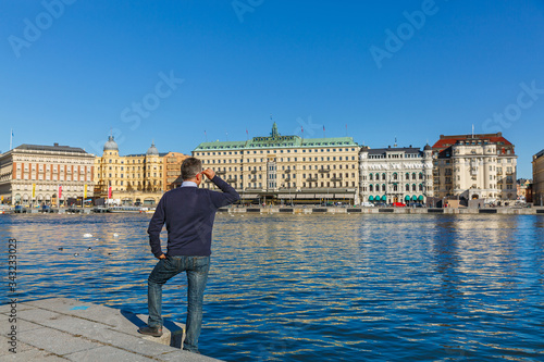 Photography Stockholm, a man looks at the architecture of the city