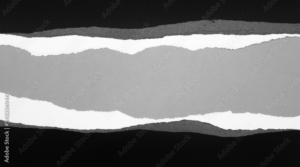 Ripped paper on grey Ripped paper on grey