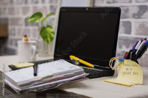 home office work with laptop planner and desk pens