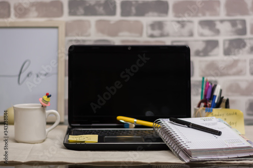 home office work with laptop planner and desk pens