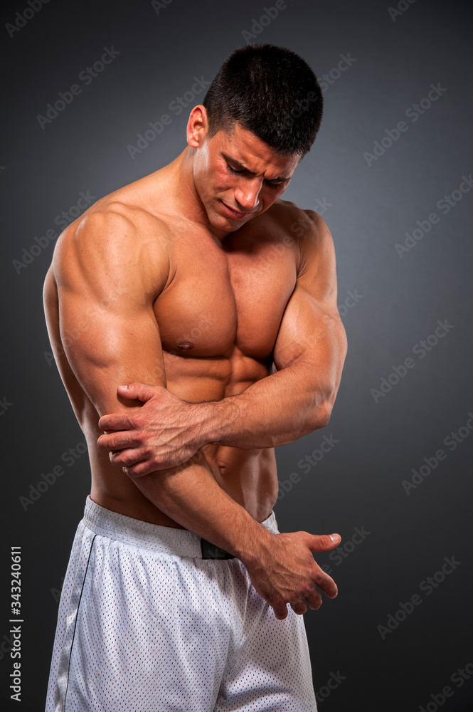 Athletic Men in Pain Due to Elbow Injury