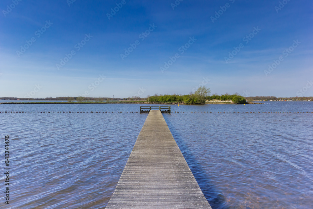 Wooden jetty at the Oldambtmeer lake in Oostwold, Netherlands