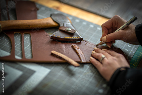Hand and leatherwork photo