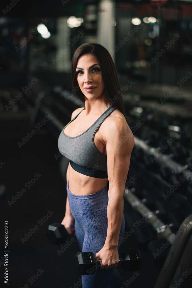 Fitness woman on training. Young woman in the gym. Fitness woman on training. Young woman in the gym.