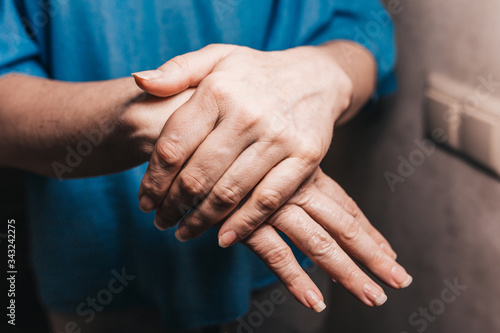 Fototapeta Naklejka Na Ścianę i Meble -  Smooth shiny skin of female hands after applying a protective cream - a remedy for wrinkles and dry skin