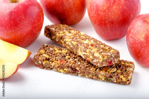 brown granola bars on red apples background