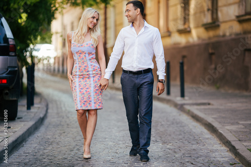 woman with her husband walking around the city, dressed neatly © ostap_davydiak