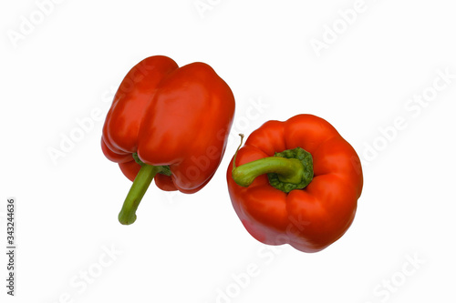 Two red bell peppers isolate on a white background close-up.