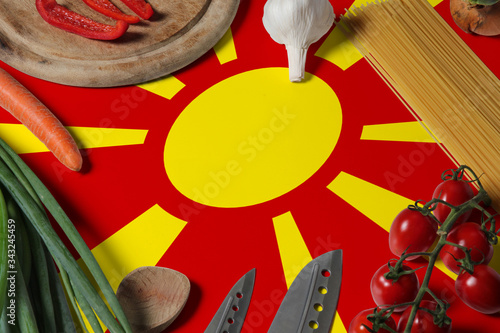 Photography Macedonia flag on fresh vegetables and knife concept wooden table