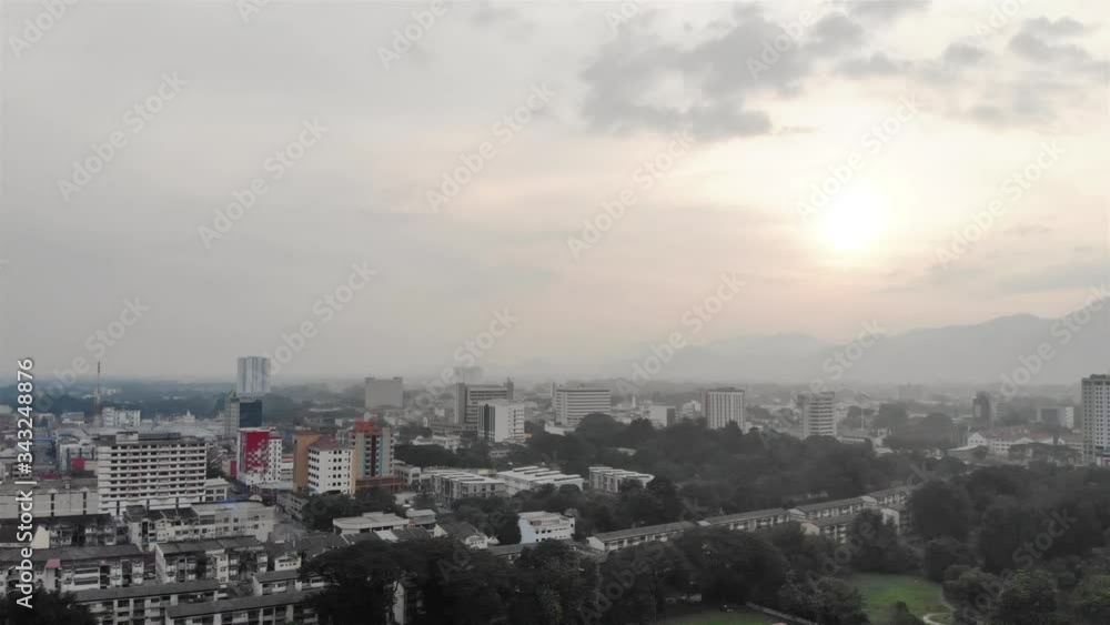Cloudy and misty view of the city with mountains - slide right Cloudy and misty view of the city with mountains - slide right