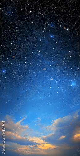 The starry sky and the blue sky together. Sunset. Night sky backgrounds with stars and clouds. Dark cosmos with stars. Sunrise in morning sky with star and milky way background. Day turns to night. © Julia