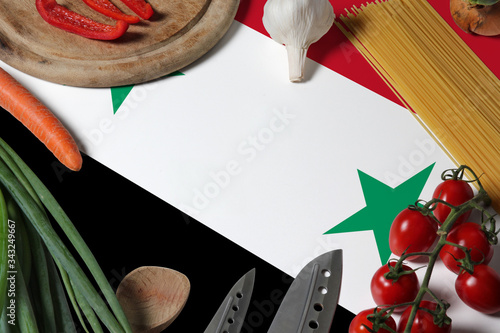 Syria flag on fresh vegetables and knife concept wooden table. Cooking concept with preparing background theme.