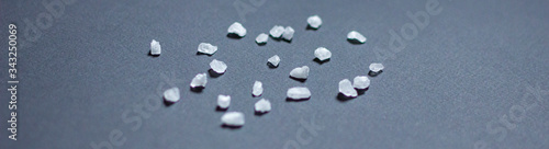 Obraz na plátně white coarse salt isolated on black background