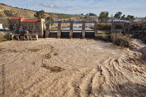 Hydroelectric power station in Mengibar releasing water after heavy rains of winter, in the province of Jaen, Spain