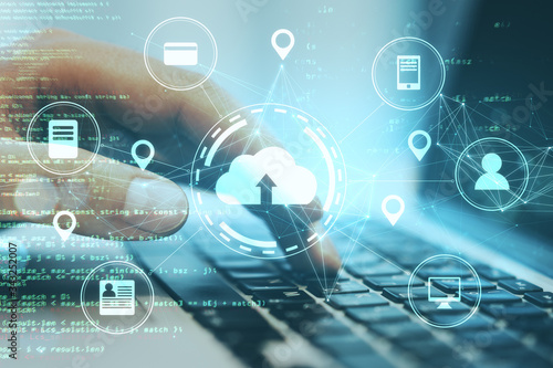 Plakat Hand using laptop with online shopping and cloud computing diagram.