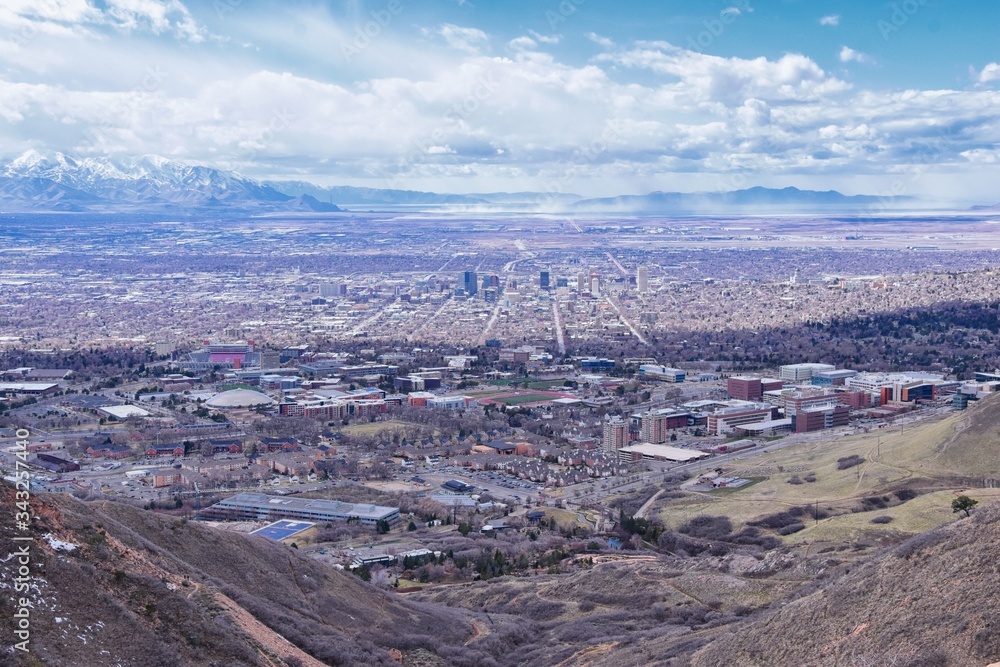 Salt Lake Valley and City panoramic views from the Red Butte Trail to the Living Room, Wasatch Front, Rocky Mountains in Utah early spring. Hiking view of trails around the University and Gardens and Salt Lake Valley and City panoramic views from the Red Butte Trail to the Living Room, Wasatch Front, Rocky Mountains in Utah early spring. Hiking view of trails around the University and Gardens and