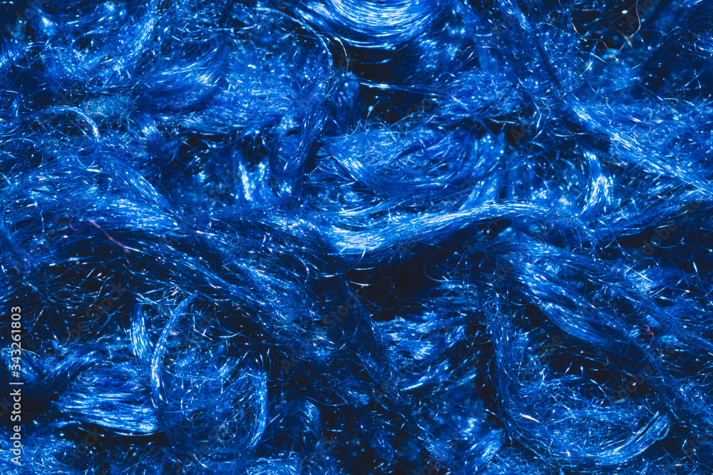 Soft fabric texture. blue textile with curly fibers. wool background Soft fabric texture. blue textile with curly fibers. wool background