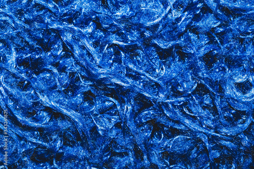 Soft fabric texture. blue textile with curly fibers. wool background Soft fabric texture. blue textile with curly fibers. wool background
