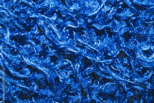 Soft fabric texture. blue textile with curly fibers. wool background