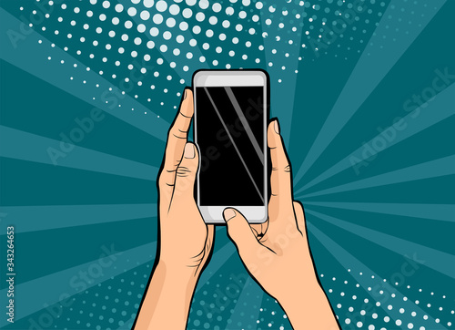 Hands holding smartphone pop art.Hands hold a mobile phone. Vector illustration in comic style.
