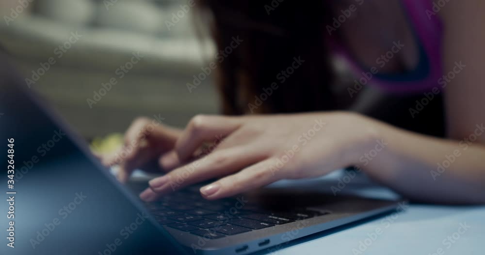 A closeup of an office worker using a computer keyboard, laptop on a sunny morning, evening. A closeup of an office worker using a computer keyboard, laptop on a sunny morning, evening.