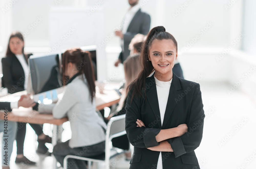 young corporate employee standing in a modern office young corporate employee standing in a modern office