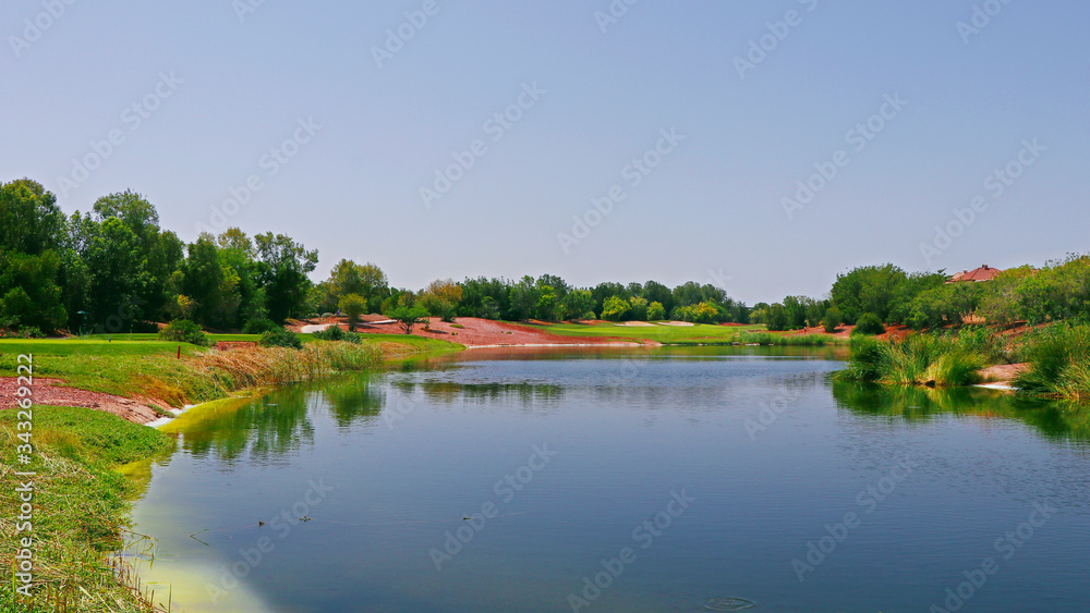 beautiful lake near the golf course in a sunny day